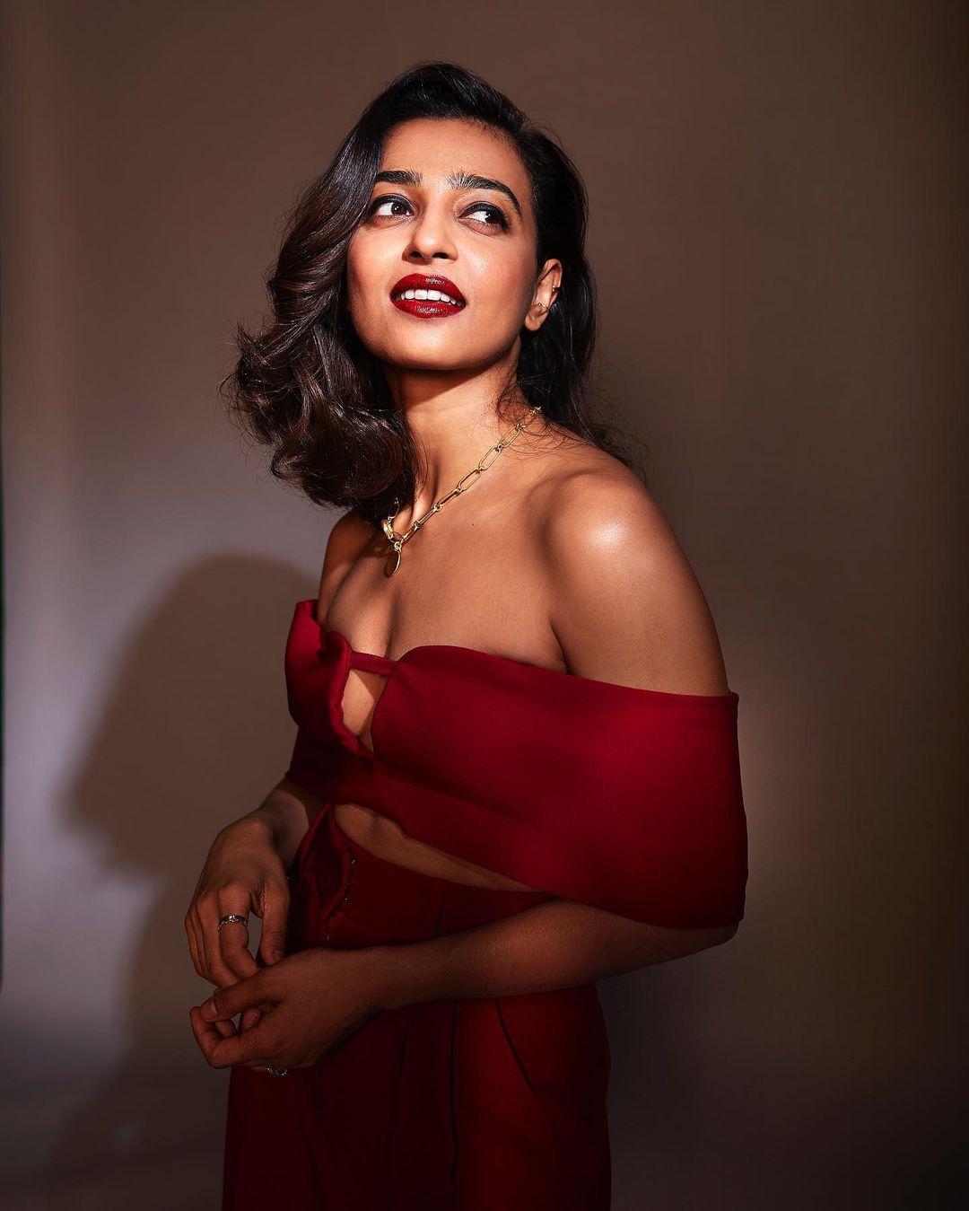 In an off-shoulder crop red top paired with red flared pants, Radhika Apte radiates casual chic vibes.&nbsp;